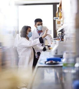 Two cancer researchers in a lab.
