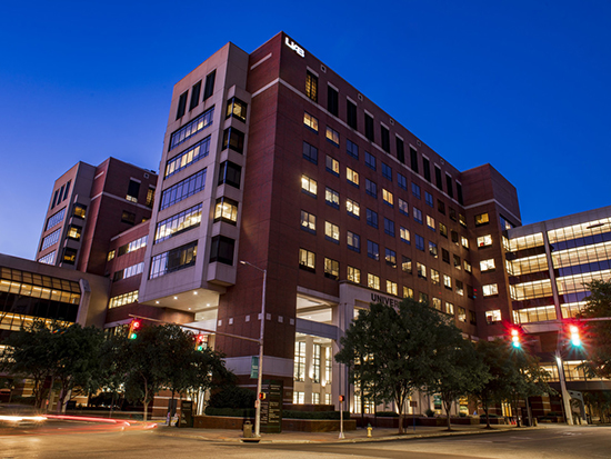 Exterior photo of UAB Hospital at nighttime