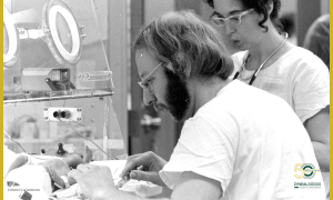 Medical staff caring for infant patient