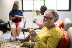 Portrait of a senior woman knitting at home