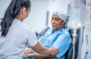 Female nurse attending to an African American female patient