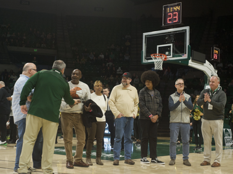 Albert Isaac at UAB Blazers vs. Southern Methodist University men’s basketball game, receiving an autographed commemorative game ball.