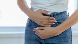 Woman holding abdomen