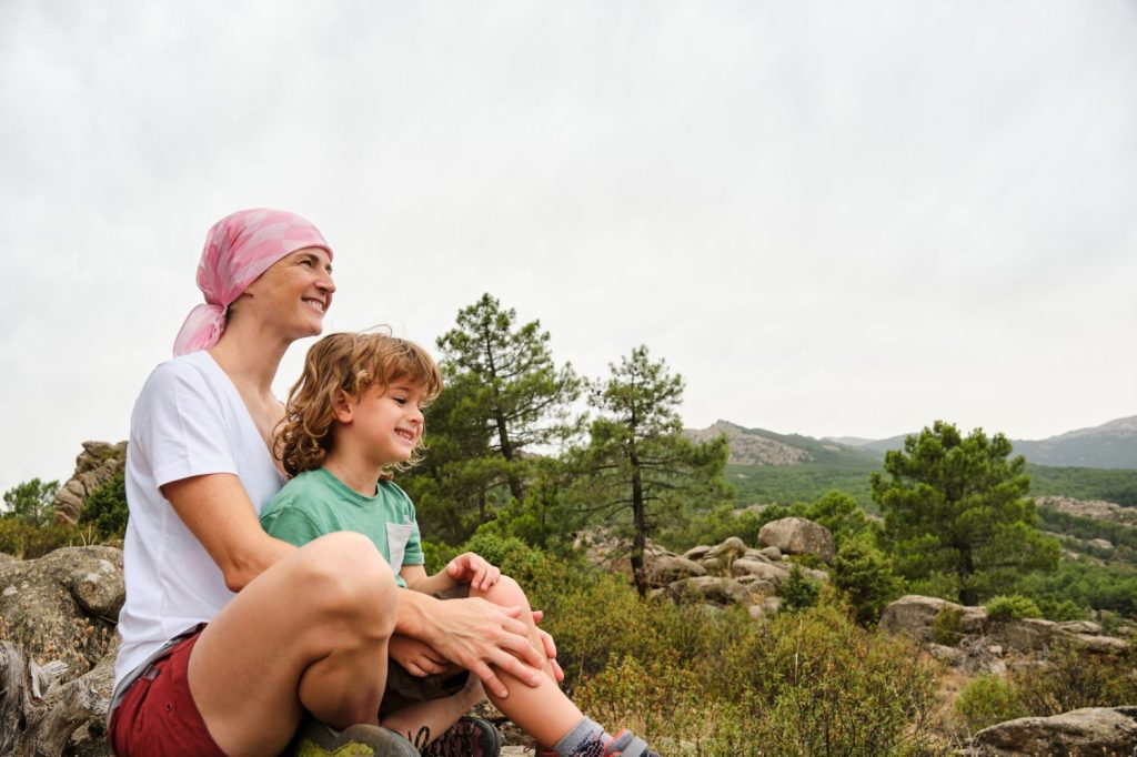 Woman with cancer enjoying nature with her son