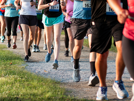 Athletes running along a path for a race