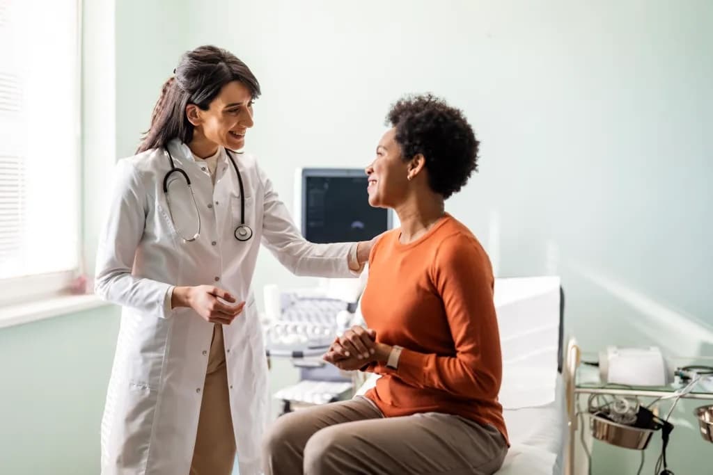 gyn-oncologist speaking to female patient