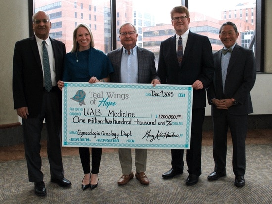 Members of Teal Wings of Hope and UAB Medicine holding a check that Teal Wings of Hope is presenting to UAB Medicine's Gynecologic Oncology Department for $1,200,000