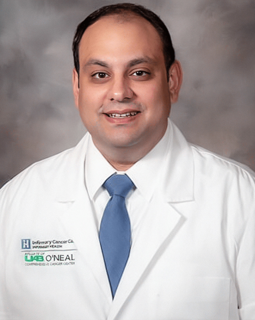 A doctor in a white lab coat and a blue tie; James Sahawneh, M.D.