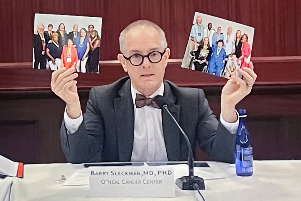 Barry Sleckman, M.D., Ph.D., delivers a presentation in front of Congress, featuring printouts of the 2024 and 2025 Iron Strong Honorees.
