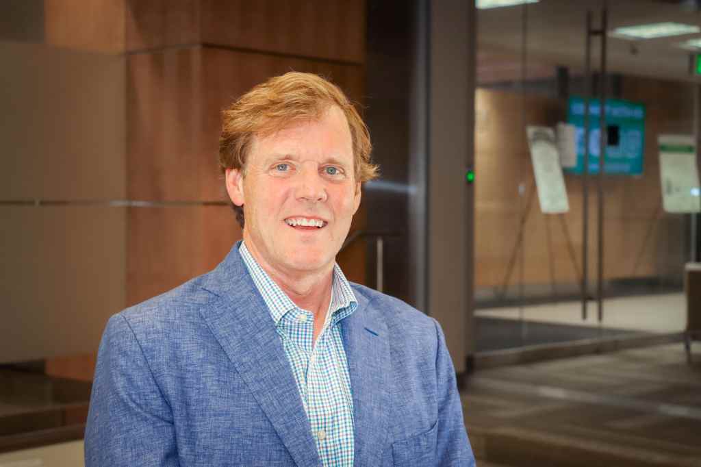 James Procotor, a 2026 Iron Strong Awardee, stands inside the Wallace Tumor Institute.