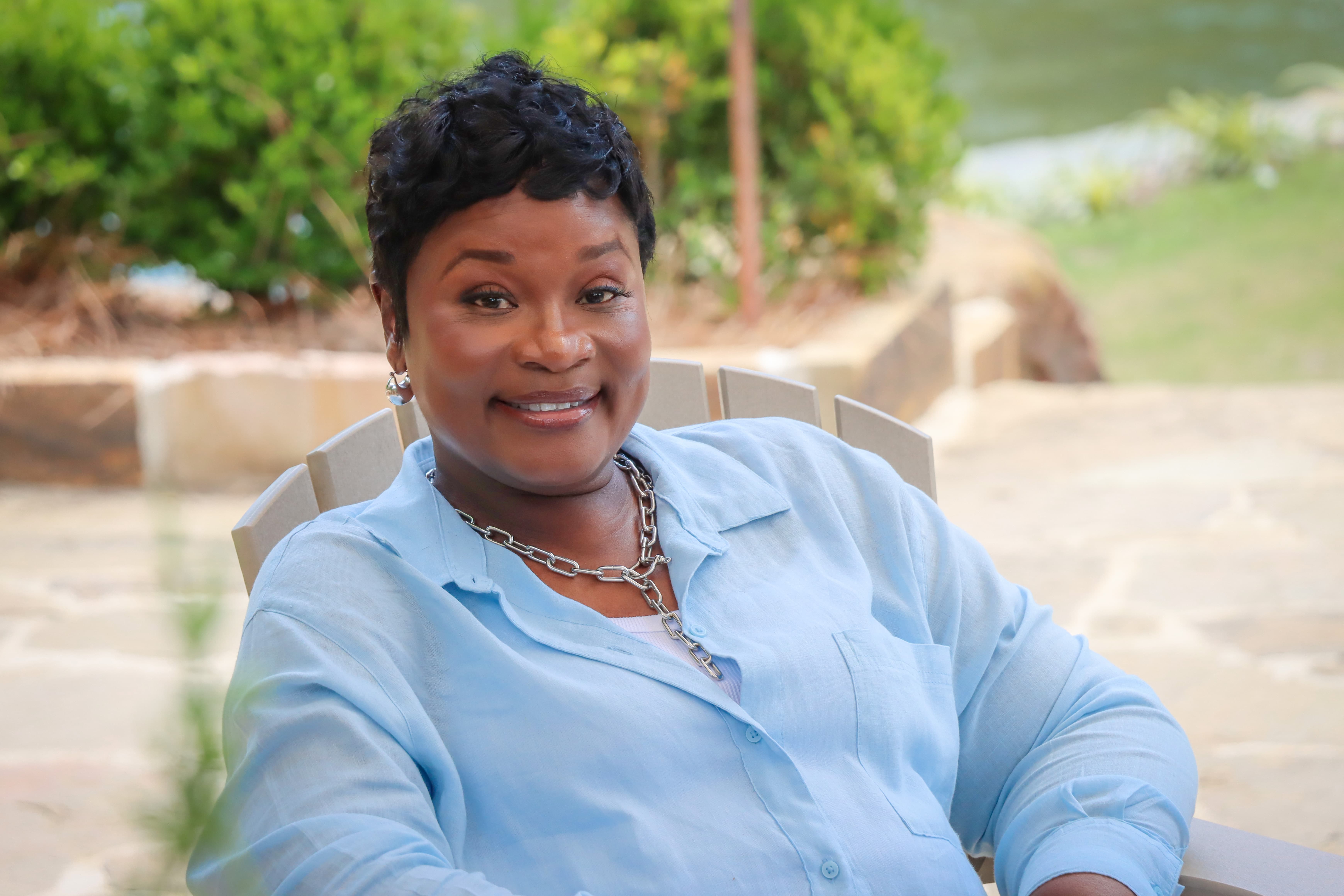 Iron Strong honoree Yolanda Jackson sitting outside, smiling to camera.