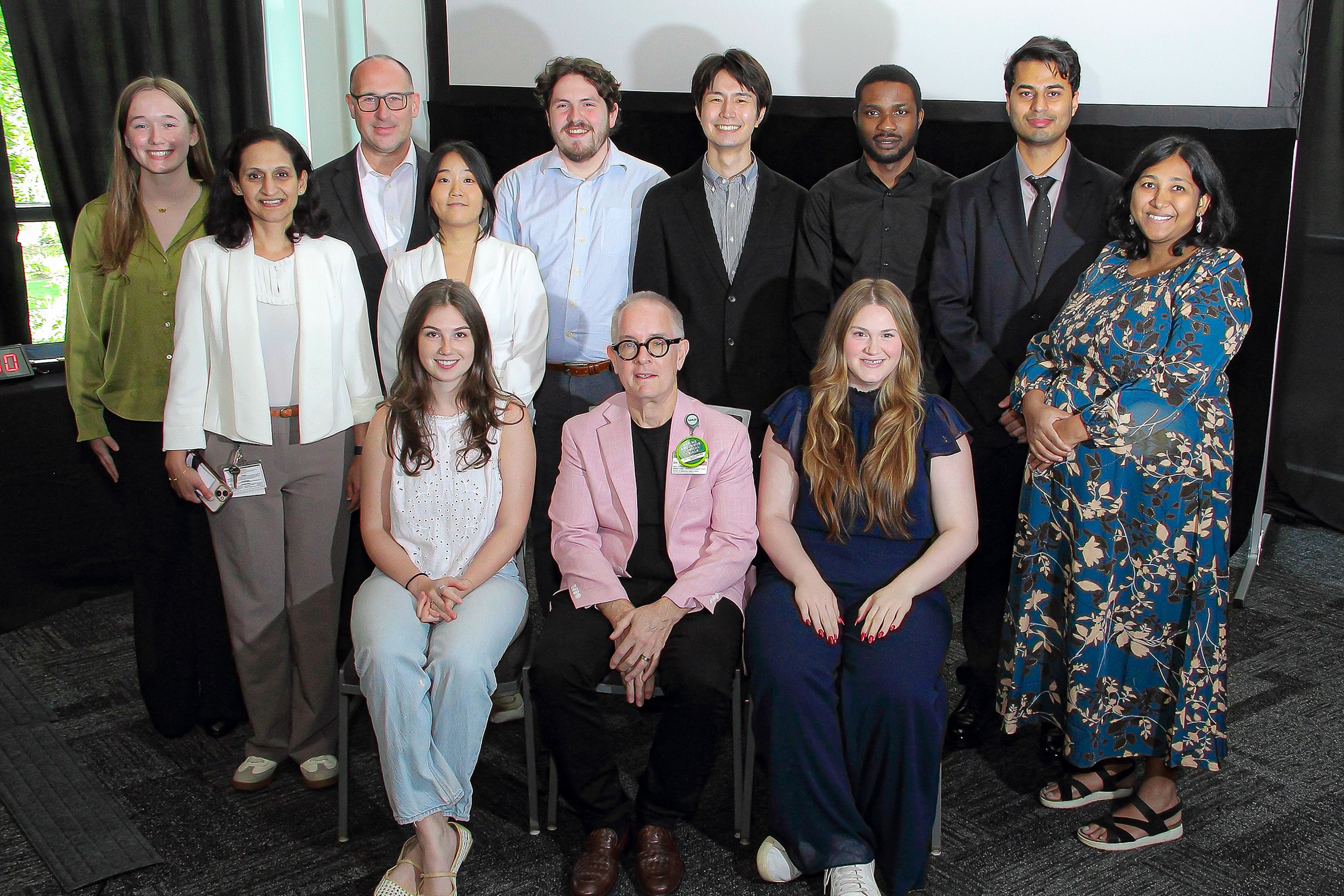 A group photo of the winners at the 2026 O'Neal Research Retreat. Pictured, left to right: Danielle George; Lalita Shevde-Samant, Ph.D.; Robert Welner, Ph.D.; Esther Lee; Caroline Ennis; Jonathan Moye; Barry Sleckman, M.D., Ph.D.; Naoki Hama; Chloe La Prairie; Opeyemi Iwaloye; Aaqid Syed, M.D.; and Divya Sahu.