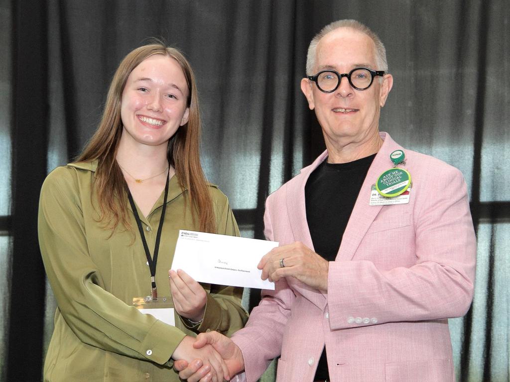 Danielle George receives an award at the 2026 O'Neal Research Retreat.