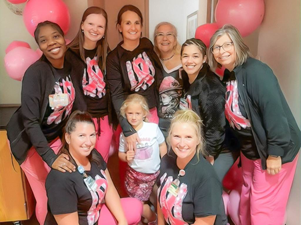 Nurses at the 2026 Pink Party; one staff member has brought their daughter.